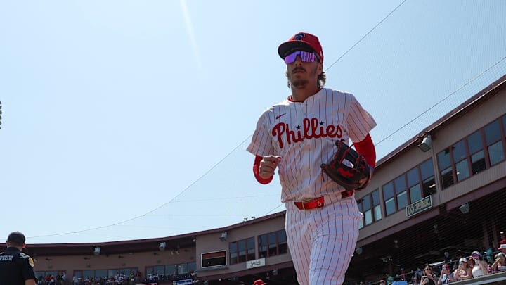 Mar 8, 2025; Clearwater, Florida, USA; Philadelphia Phillies second baseman Bryson Stott (5) takes the field for a game against the Toronto Blue Jays during spring training at BayCare Ballpark.