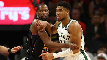 Feb 6, 2024; Phoenix, Arizona, USA; Milwaukee Bucks forward Giannis Antetokounmpo (34) against Phoenix Suns forward Kevin Durant (35) at Footprint Center. Mandatory Credit: Mark J. Rebilas-Imagn Images