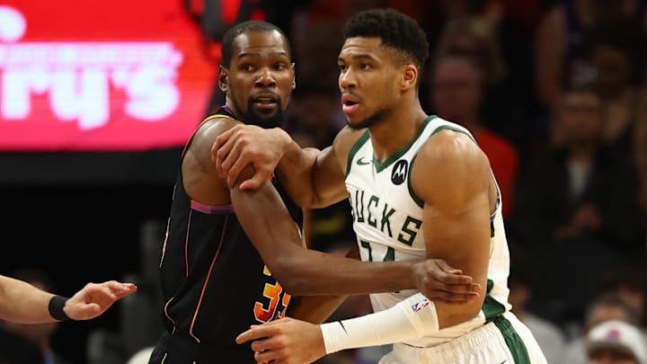 Feb 6, 2024; Phoenix, Arizona, USA; Milwaukee Bucks forward Giannis Antetokounmpo (34) against Phoenix Suns forward Kevin Durant (35) at Footprint Center. Mandatory Credit: Mark J. Rebilas-Imagn Images