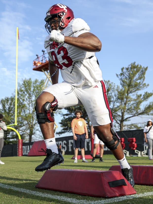 Indiana defensive tackle Robby Harrison takes part in a drill during spring practice.