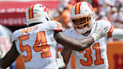 Sep 21, 2025; Tampa, Florida, USA; Tampa Bay Buccaneers safety Antoine Winfield Jr. (31) is congratulated by outside linebacker Lavonte David (54) after he forces a fumble against the Tampa Bay Buccaneer against the New York Jets during the second quarter at Raymond James Stadium. Mandatory Credit: Kim Klement Neitzel-Imagn Images