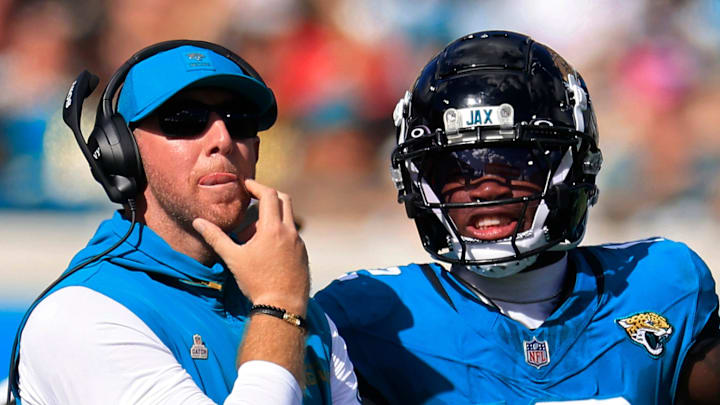 Jacksonville Jaguars head coach Liam Coen looks to the video scoreboard with wide receiver Travis Hunter (12) during the fourth quarter of an NFL football matchup, Sunday, Oct. 12, 2025, at EverBank Stadium in Jacksonville, Fla. 