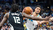 Apr 22, 2025; Indianapolis, Indiana, USA; Indiana Pacers guard Tyrese Haliburton (0) dribbles the ball while Milwaukee Bucks forward Taurean Prince (12) defends during game two of first round for the 2024 NBA Playoffs at Gainbridge Fieldhouse. Mandatory Credit: Trevor Ruszkowski-Imagn Images