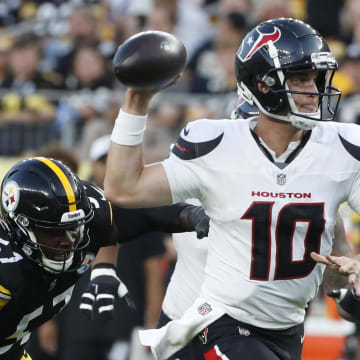 Aug 9, 2024; Pittsburgh, Pennsylvania, USA;  Houston Texans quarterback Davis Mills (10) scrambles with the ball past Pittsburgh Steelers defensive tackle Montravius Adams (57) during the second quarter at Acrisure Stadium.  Houston won 20-12. Mandatory Credit: Charles LeClaire-USA TODAY Sports