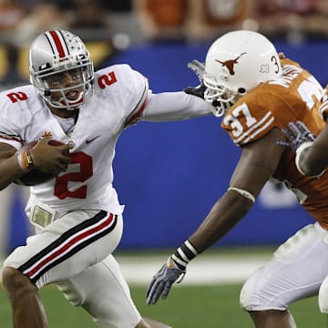 Jan 5, 2009, Glendale, AZ, USA; Ohio State quarterback Terrelle Pryor (2) runs for a first down in the first quarter as Texas defensive end Henry Melton (37) attempts to make the stop at the 2009 Fiesta Bowl at University of Phoenix Stadium. The Texas Longhorns defeated the Ohio State Buckeyes 24-21. Mandatory Credit: Leon Halip-Imagn Images