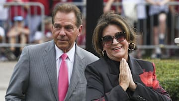 Sep 7, 2024; Tuscaloosa, Alabama, USA;  Alabama Crimson Tide former head coach Nick Saban and his wife Terry react during a ceremony to rename the field at Bryant-Denny Stadium in his honor. The new name is Saban Field at Bryant-Denny Stadium.. Mandatory Credit: Gary Cosby Jr.-Imagn Images