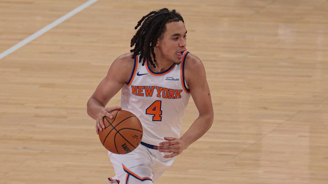 Oct 13, 2025; New York, New York, USA; New York Knicks forward Pacome Dadiet (4) dribbles up court against the Washington Wizards during the first quarter at Madison Square Garden. Mandatory Credit: Vincent Carchietta-Imagn Images