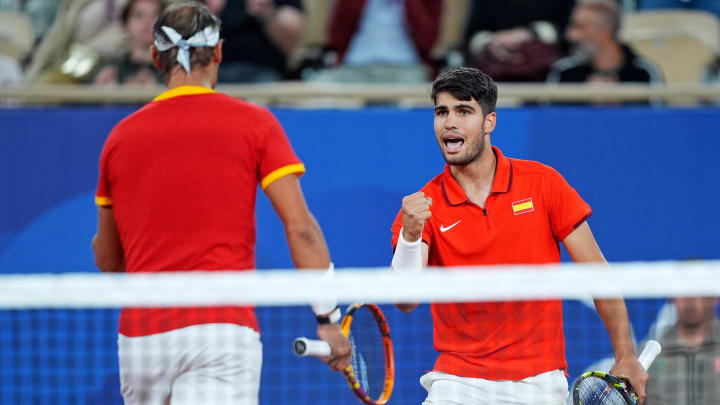 Jul 28, 2024; Paris, France; Rafael Nadal (ESP) and Carlos Alcaraz (ESP) celebrate during their match against Maximo Gonzales (ARG) and Andres Molteni (ARG) in the men's tennis doubles first round during the Paris 2024 Olympic Summer Games at Stade Roland Garros. Mandatory Credit: Amber Searls-USA TODAY Sports