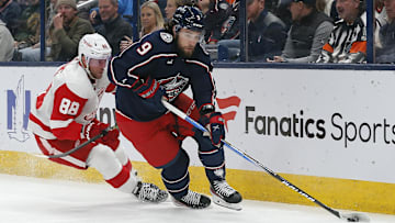 Oct 16, 2023; Columbus, Ohio, USA; Columbus Blue Jackets defenseman Ivan Provorov (9) carries the puck away from Detroit Red Wings right wing Daniel Sprong (88) during the first period at Nationwide Arena. Mandatory Credit: Russell LaBounty-Imagn Images