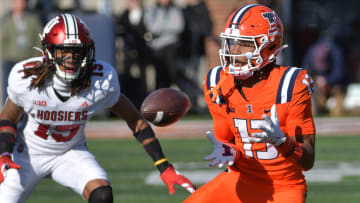 Nov 11, 2023; Champaign, Illinois, USA;  Illinois Fighting Illini wide receiver Pat Bryant (13) catches a pass in front of Indiana Hoosiers defensive back Nic Toomer (15) during the second half at Memorial Stadium. Mandatory Credit: Ron Johnson-USA TODAY Sports