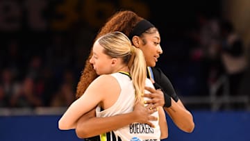 May 29, 2025; Chicago, Illinois, USA; Chicago Sky forward Angel Reese (5) and Dallas Wings guard Paige Bueckers (5) hug prior to a game at the Wintrust Arena. Mandatory Credit: Patrick Gorski-Imagn Images