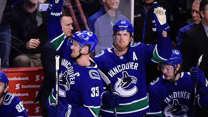 Apr 3, 2018; Vancouver, British Columbia, CAN; Vancouver Canucks forward Henrik Sedin (33) and forward Daniel Sedin (22) acknowledge the fans during the third period against the Las Vegas Knights at Rogers Arena. Mandatory Credit: Anne-Marie Sorvin-USA TODAY Sports
