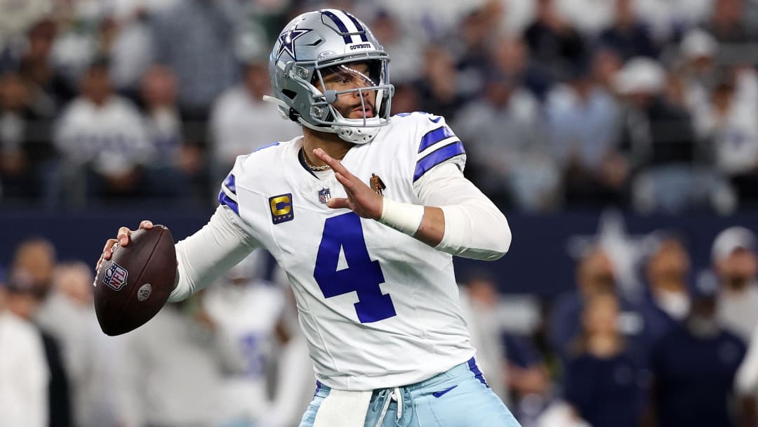 Jan 14, 2024; Arlington, Texas, USA; Dallas Cowboys quarterback Dak Prescott (4) drops back to pass against the Green Bay Packers in the first half of the 2024 NFC wild card game at AT&T Stadium.