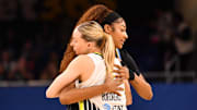 May 29, 2025; Chicago, Illinois, USA; Chicago Sky forward Angel Reese (5) and Dallas Wings guard Paige Bueckers (5) hug prior to a game at the Wintrust Arena. Mandatory Credit: Patrick Gorski-Imagn Images