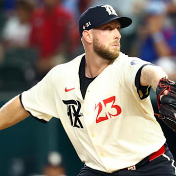 Aug 8, 2025; Arlington, Texas, USA;  Texas Rangers starting pitcher Merrill Kelly (23) throws during the first inning against the Philadelphia Phillies at Globe Life Field. Mandatory Credit: Kevin Jairaj-Imagn Images