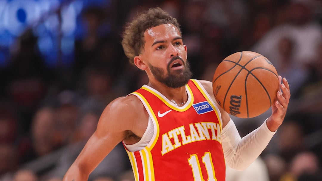 Oct 22, 2025; Atlanta, Georgia, USA; Atlanta Hawks guard Trae Young (11) dribbles against the Toronto Raptors in the first quarter at State Farm Arena.
