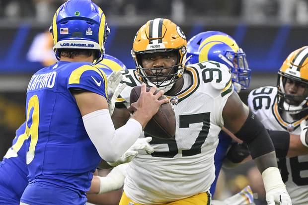 Kenny Clark (97) pressures Los Angeles Rams quarterback Matthew Stafford (9) during the fourth quarter at SoFi Stadium. 