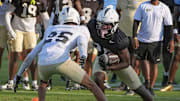 UCF running back Agyeman Addae competes with Rukeem Stroud during UCF Spring football practice at FBC Mortgage Stadium in Orlando, Friday, April 11, 2025.