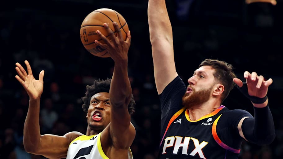 Utah Jazz guard Collin Sexton shoots the ball against Phoenix Suns center Jusuf Nurkic. | Mark J. Rebilas-Imagn Images