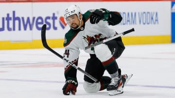 Feb 18, 2024; Denver, Colorado, USA; Arizona Coyotes defenseman Matt Dumba (24) breaks his stick on