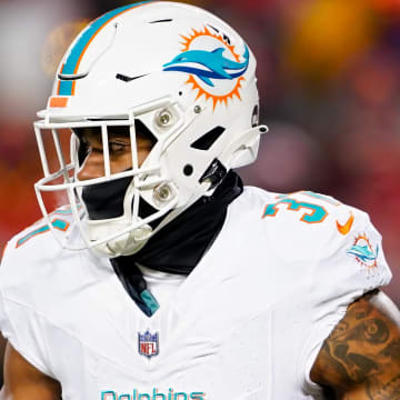 Miami Dolphins running back Raheem Mostert (31) runs the ball during the first half of a 2024 AFC wild card game against the Kansas City Chiefs at GEHA Field at Arrowhead Stadium.