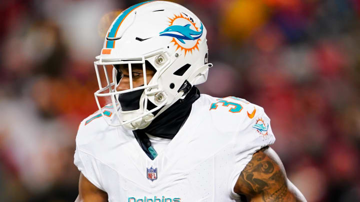 Miami Dolphins running back Raheem Mostert (31) runs the ball during the first half of a 2024 AFC wild card game against the Kansas City Chiefs at GEHA Field at Arrowhead Stadium.