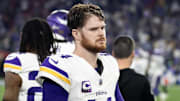 Jan 13, 2025; Glendale, AZ, USA; Minnesota Vikings quarterback Sam Darnold (14) reacts in the closing seconds of the game against the Los Angeles Rams during an NFC wild card game at State Farm Stadium. Mandatory Credit: Mark J. Rebilas-Imagn Images