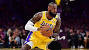 Los Angeles Lakers forward LeBron James runs with the ball.