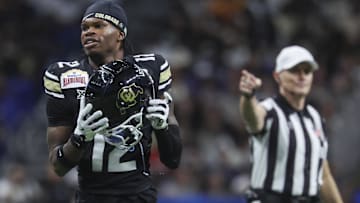 Dec 28, 2024; San Antonio, TX, USA; Colorado Buffaloes wide receiver Travis Hunter (12) reacts after a penalty is called during the second quarter against the Brigham Young Cougars at Alamodome. Mandatory Credit: Troy Taormina-Imagn Images