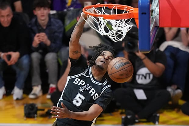 San Antonio Spurs forward Stephon Castle (5) competes in the slam dunk competition during All-Star Saturday Night.