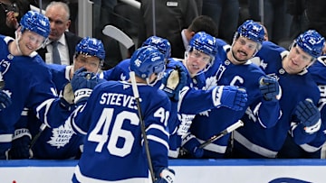 Feb 22, 2025; Toronto, Ontario, CAN;  Toronto Maple Leafs forward Alex Steeves (46) celebrates with teammates at the bench after scoring a goal against the Carolina Hurricanes in the first period at Scotiabank Arena. Mandatory Credit: Dan Hamilton-Imagn Images