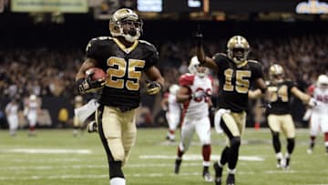 Jan 16, 2010; New Orleans, LA, USA; New Orleans Saints running back Reggie Bush (25) returns a punt for a touchdown against the Arizona Cardinals during the third quarter of the 2010 NFC divisional playoff game at the Louisiana Superdome.  Mandatory Credit: Matt Stamey-Imagn Images