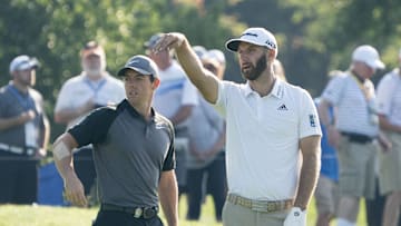 Rory McIlroy (left) and Dustin Johnson stand on the seventh fairway during the Wednesday practice round of the PGA Championship at Bellerive Country Club. Kyle Terada-Imagn Images