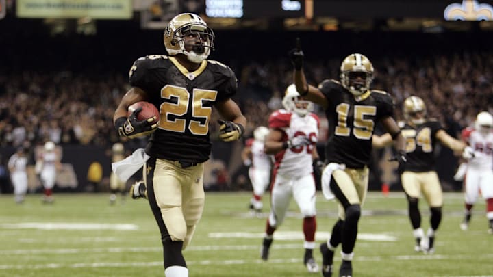 Jan 16, 2010; New Orleans, LA, USA; New Orleans Saints running back Reggie Bush (25) returns a punt for a touchdown against the Arizona Cardinals during the third quarter of the 2010 NFC divisional playoff game at the Louisiana Superdome.  Mandatory Credit: Matt Stamey-Imagn Images