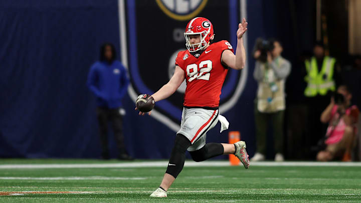 Dec 7, 2024; Atlanta, GA, USA; Georgia Bulldogs punter Brett Thorson (92) punts the ball to the Texas Longhorns during the first half in the 2024 SEC Championship game at Mercedes-Benz Stadium. Mandatory Credit: Brett Davis-Imagn Images