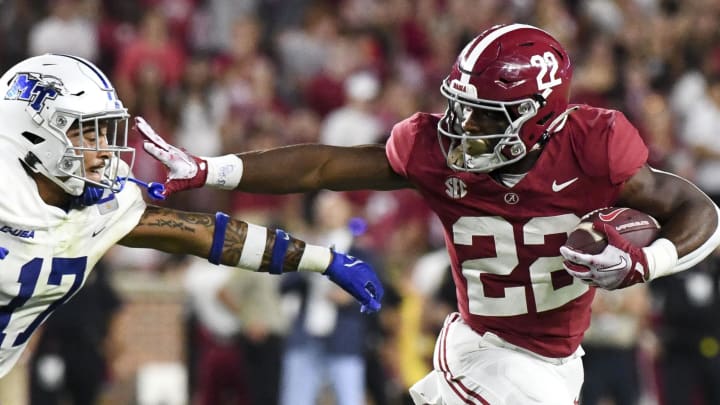 Sep 2, 2023; Tuscaloosa, Alabama, USA;  Alabama Crimson Tide running back Justice Haynes (22) stiff arms Middle Tennessee Blue Raiders safety Tra Fluellen (17) during the second half at Bryant-Denny Stadium. Alabama won 56-7. Mandatory Credit: Gary Cosby Jr.-USA TODAY Sports