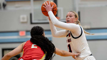 Sacred Heart's Reagan Bender (21) looks for an open pass around Incarnate Word   s Nevaeh Caffey (2) during their game on Saturday, Jan. 20, 2024 at Mercy Academy during the Raatz Fence/O'Shea's Basketball Classic.