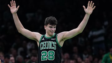 Nov 26, 2025; Boston, Massachusetts, USA; Boston Celtics guard Hugo Gonzalez (28) reacts after being called for a foul against Detroit Pistons guard Cade Cunningham (2) in the second half at TD Garden.