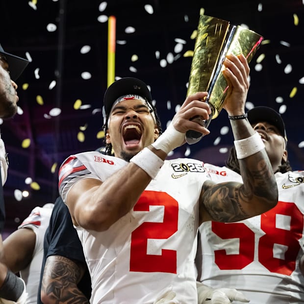 Ohio State Buckeyes wide receiver Emeka Egbuka celebrates with the trophy after defeating the Notre Dame Fighting Irish. 