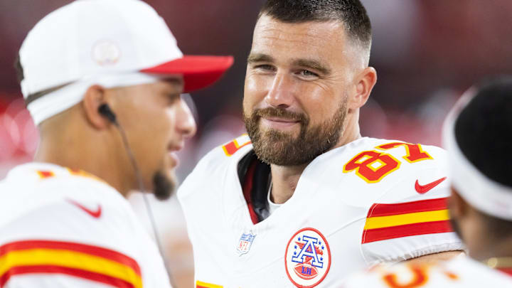 Aug 9, 2025; Glendale, Arizona, USA; Kansas City Chiefs tight end Travis Kelce (87) with quarterback Patrick Mahomes (15) against the Arizona Cardinals during a preseason NFL game at State Farm Stadium. 