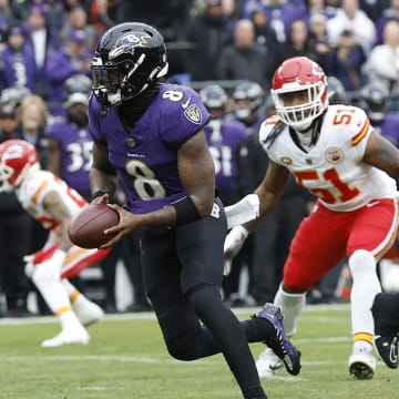 Jan 28, 2024; Baltimore, Maryland, USA; Baltimore Ravens quarterback Lamar Jackson (8) runs with the ball against the Kansas City Chiefs during the first quarter in the AFC Championship football game at M&T Bank Stadium. Mandatory Credit: Geoff Burke-USA TODAY Sports