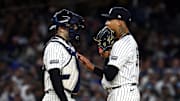 Oct 29, 2024; Bronx, New York, USA; New York Yankees pitcher Luis Gil (81) talks with catcher Austin Wells (28) in the third inning during game four of the 2024 MLB World Series at Yankee Stadium. 