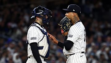 Oct 29, 2024; Bronx, New York, USA; New York Yankees pitcher Luis Gil (81) talks with catcher Austin Wells (28) in the third inning during game four of the 2024 MLB World Series at Yankee Stadium. 