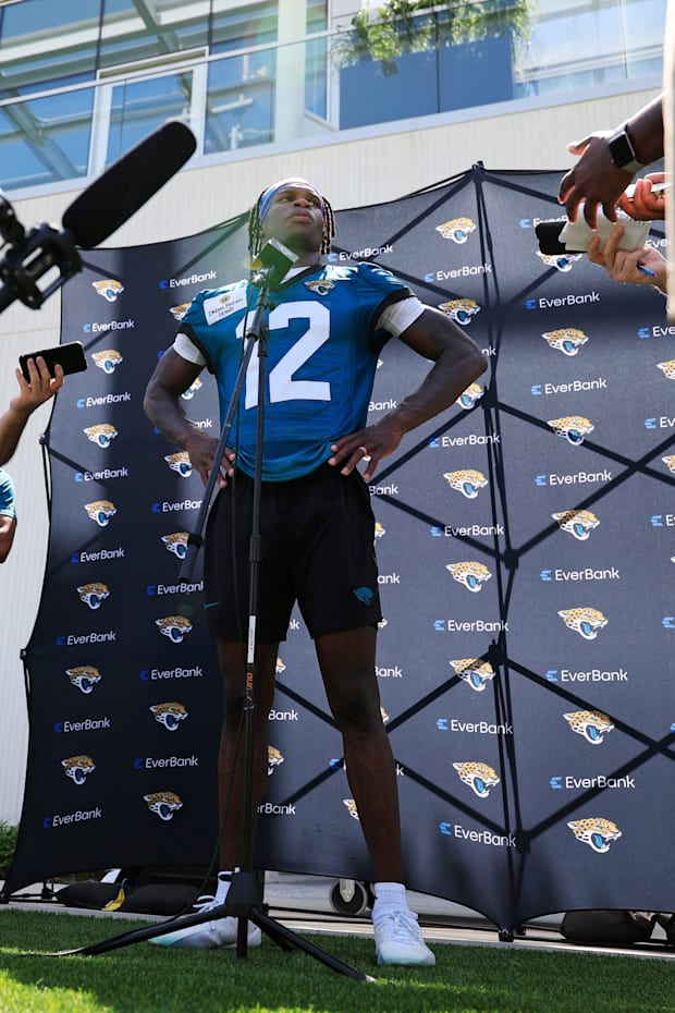 Jacksonville Jaguars wide receiver Travis Hunter (12) speaks to members of the media during the second mandatory minicamp at 