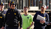 Michigan Wolverines head coach Jim Harbaugh watches from the sideline beside off-field analyst Connor Stalions, right, during a game against the Ohio State Buckeyes at Ohio Stadium in 2022.