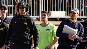 Michigan Wolverines head coach Jim Harbaugh watches from the sideline beside off-field analyst Connor Stalions, right, during a game against the Ohio State Buckeyes at Ohio Stadium in 2022.