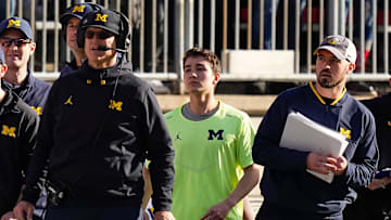 Nov 26, 2022; Columbus, Ohio, USA; Michigan Wolverines head coach Jim Harbaugh watches from the sideline beside off-field analyst Connor Stalions, right, during the NCAA football game against the Ohio State Buckeyes at Ohio Stadium.