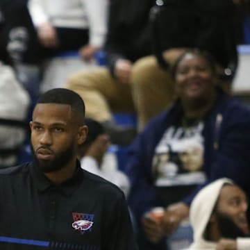 Pine Forest head coach Ty McCants keeps an eye on the court during the Pine Forest at Booker T. Washington boys basketball game on Friday, Dec. 13, 2024.