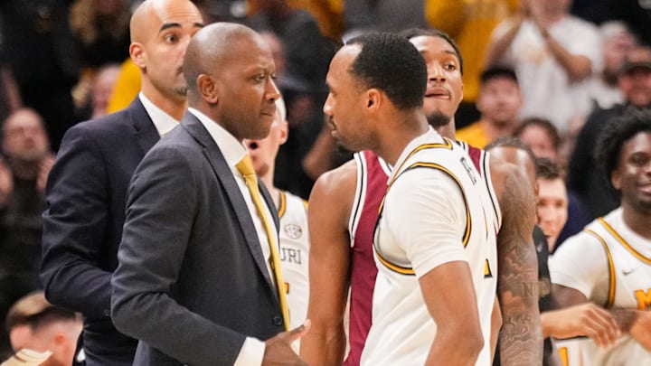 Feb 25, 2025; Columbia, Missouri, USA; Missouri Tigers head coach Dennis Gates celebrates with guard Tamar Bates (2) after a score against the South Carolina Gamecocks during the second half at Mizzou Arena. Mandatory Credit: Denny Medley-Imagn Images