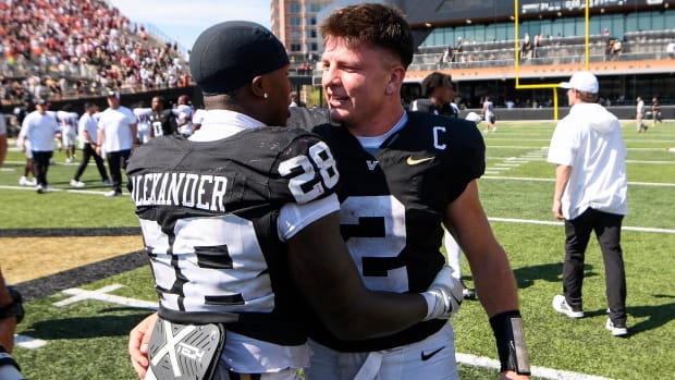 Vanderbilt quarterback Diego Pavia celebrates an upset of Virginia Tech with running back Sedrick Alexander.